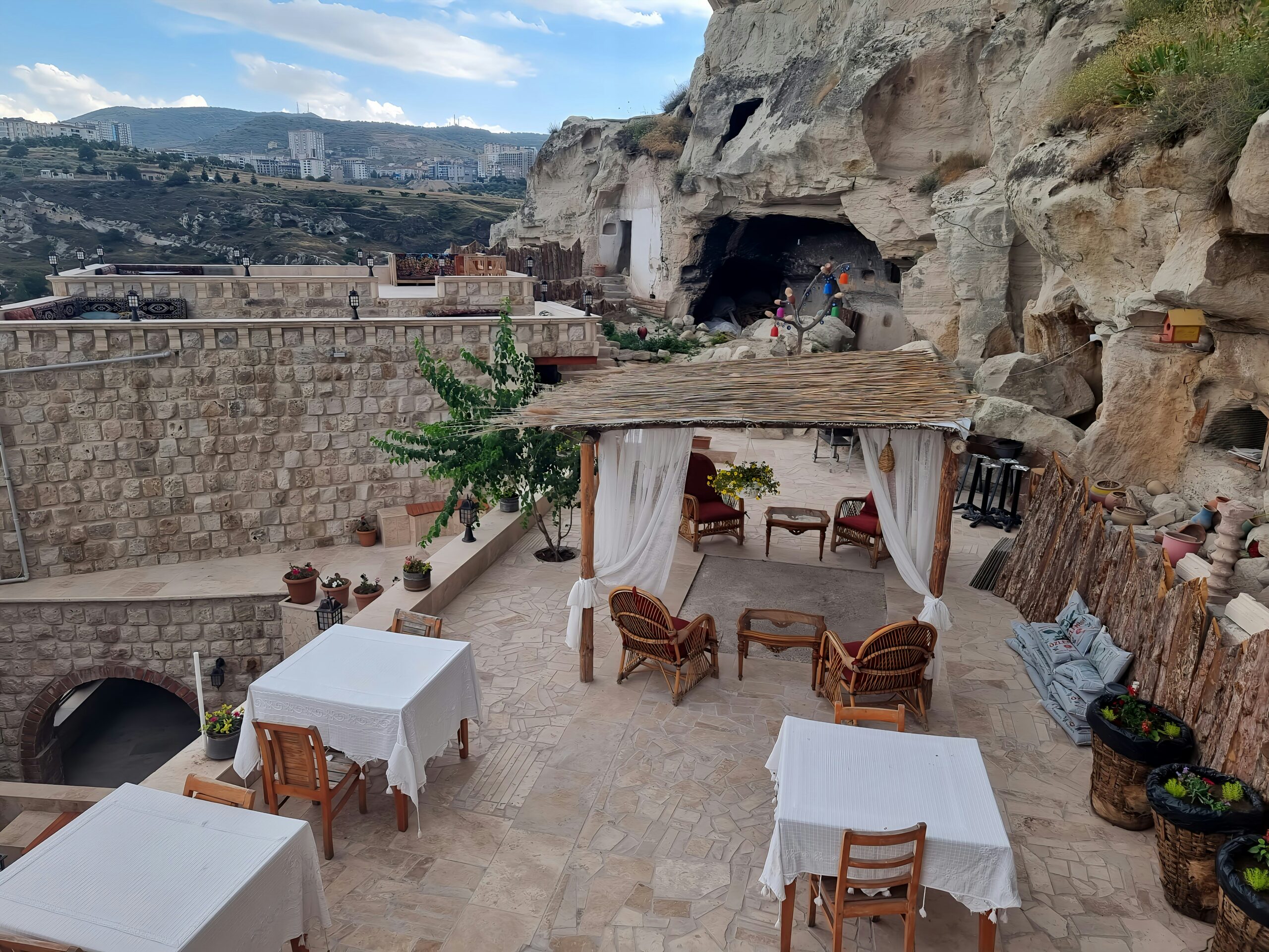 an outdoor dining area with tables and chairs